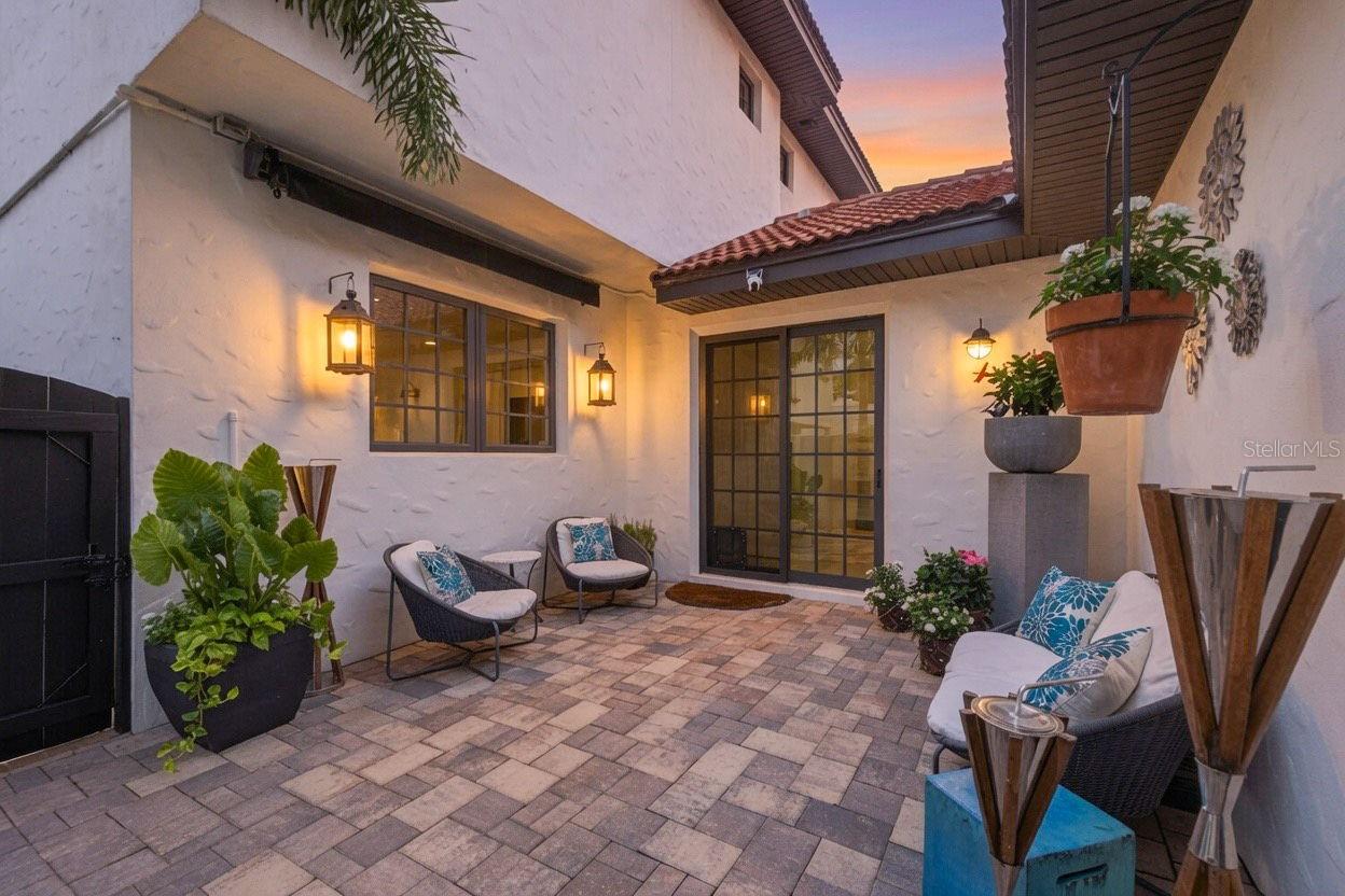 Private back courtyard with sun shade.