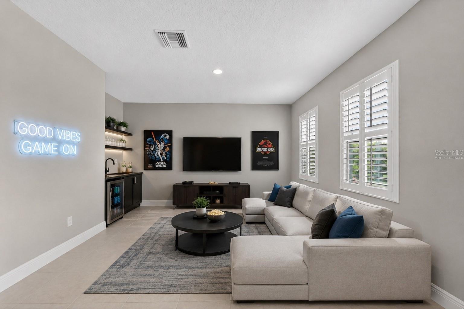 Virtually staged up stairs bonus room