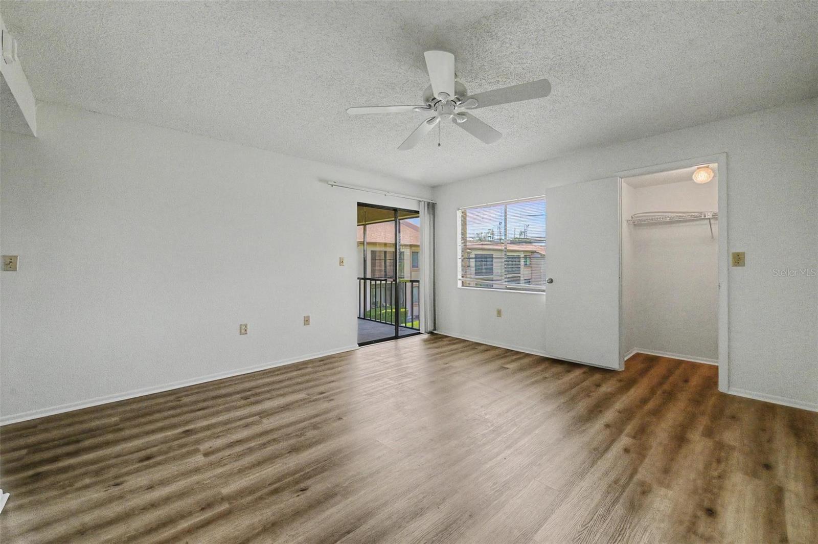 Primary Bedroom offers en-suite bathroom, 3 walk-in closets and sliders to the screened balcony.