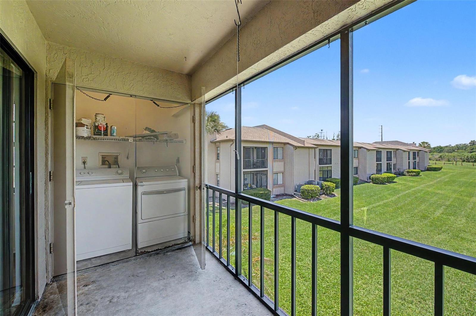 Screened balcony - laundry closet.