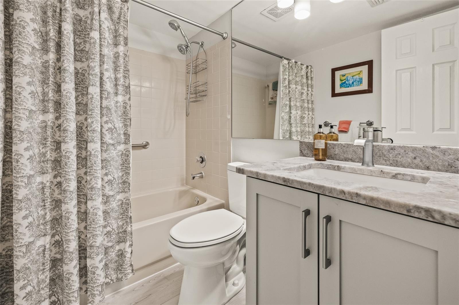 Second bathroom with bathtub/shower.