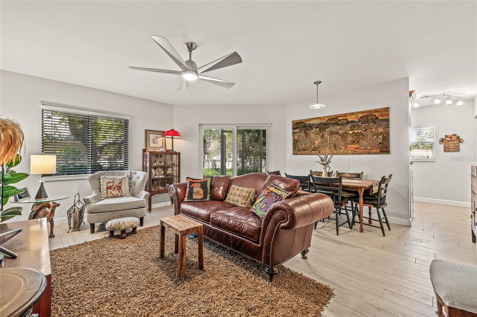 Large and spacious living room. Recently removed all popcorn ceilings and new ceiling fans.