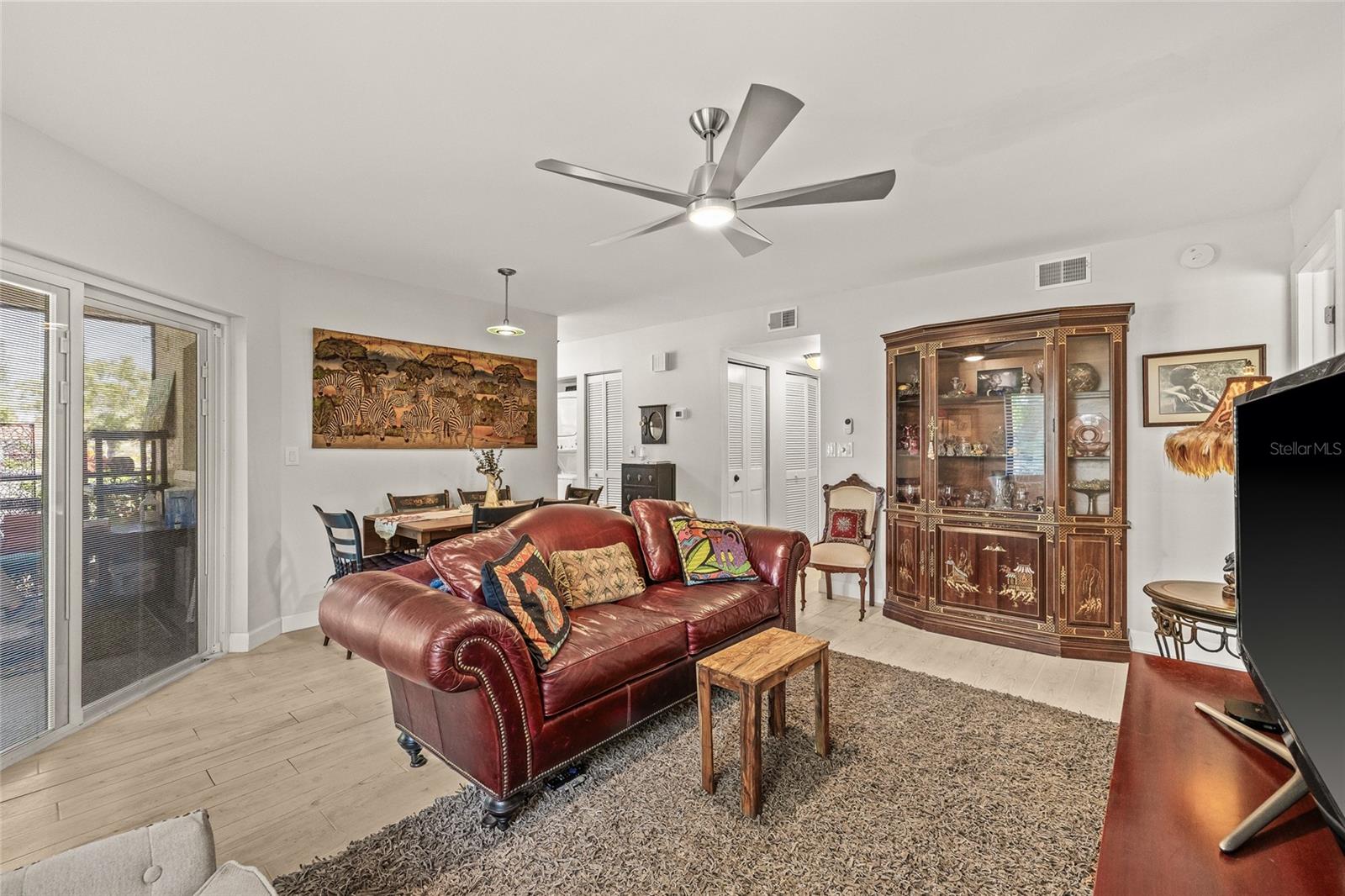Living room with sliders leading to the porch.
