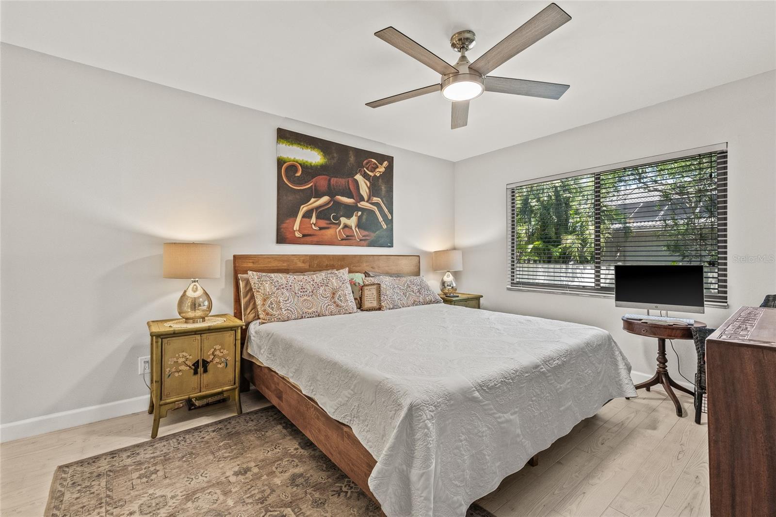 Primary bedroom with updated wood plank tile.