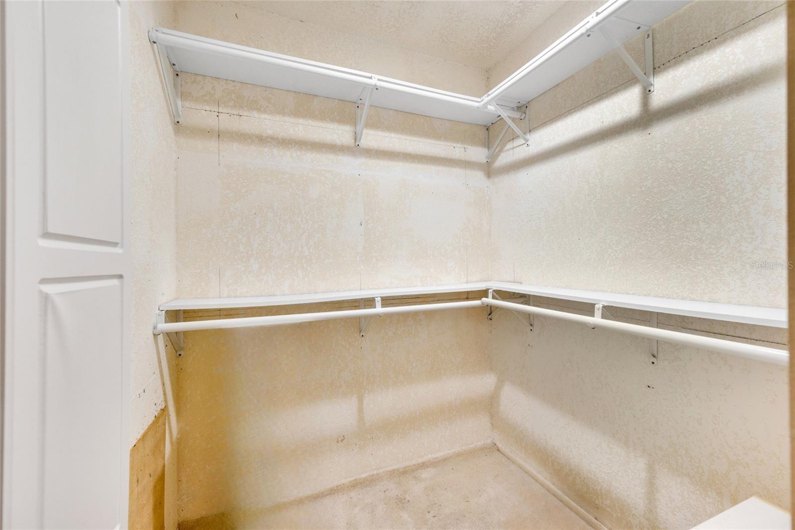 SPACIOUS WALK IN CLOSET IN MASTER BEDROOM