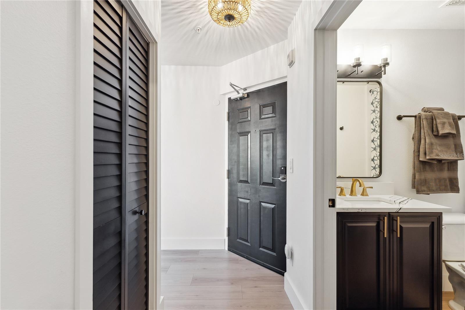 View of foyer and bathroom