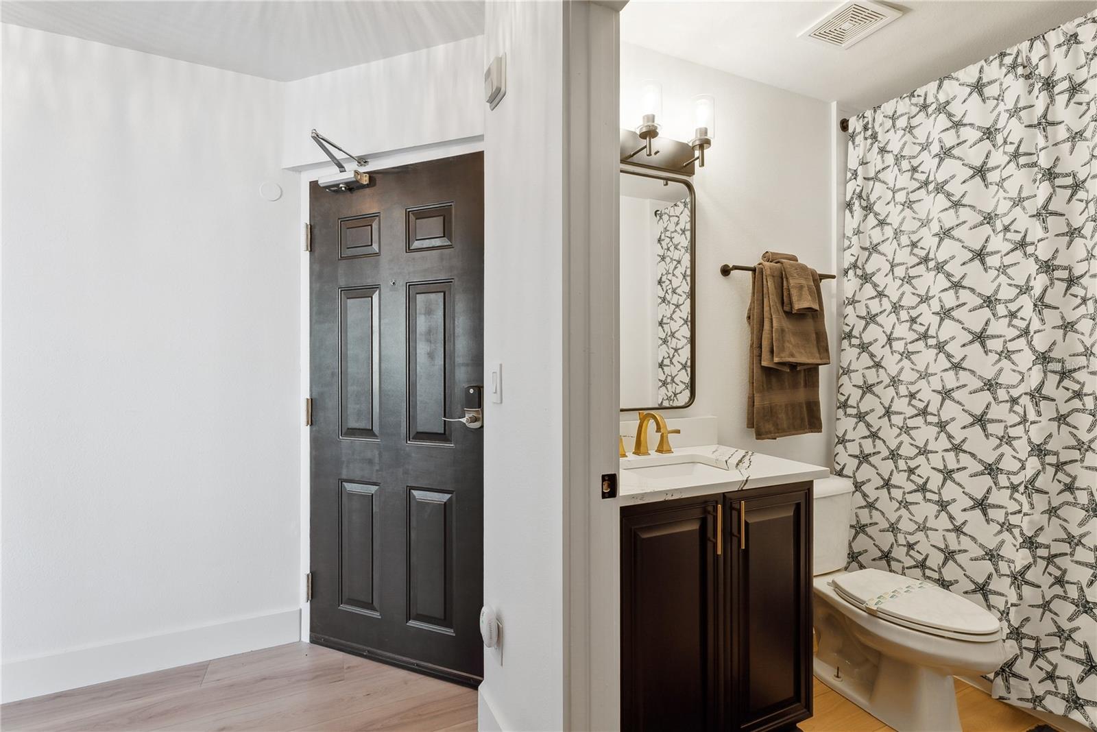 View of foyer and bathroom