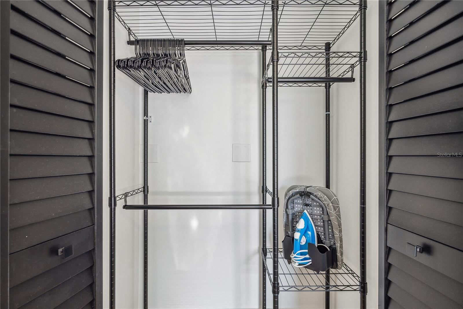 Spacious bedroom closet with storage rack