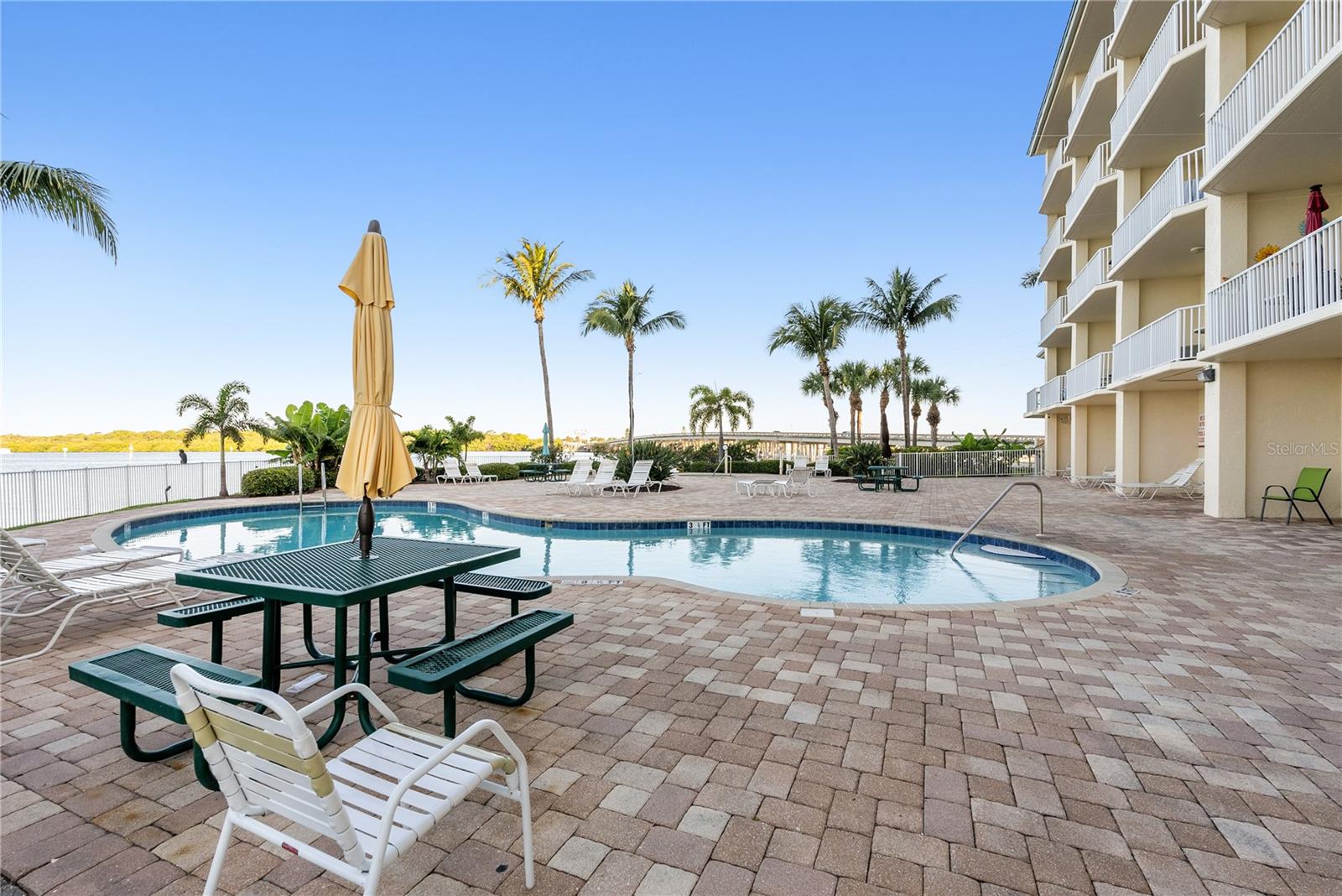 View of waterside heated pool overlooking the Boca Ciega Bay