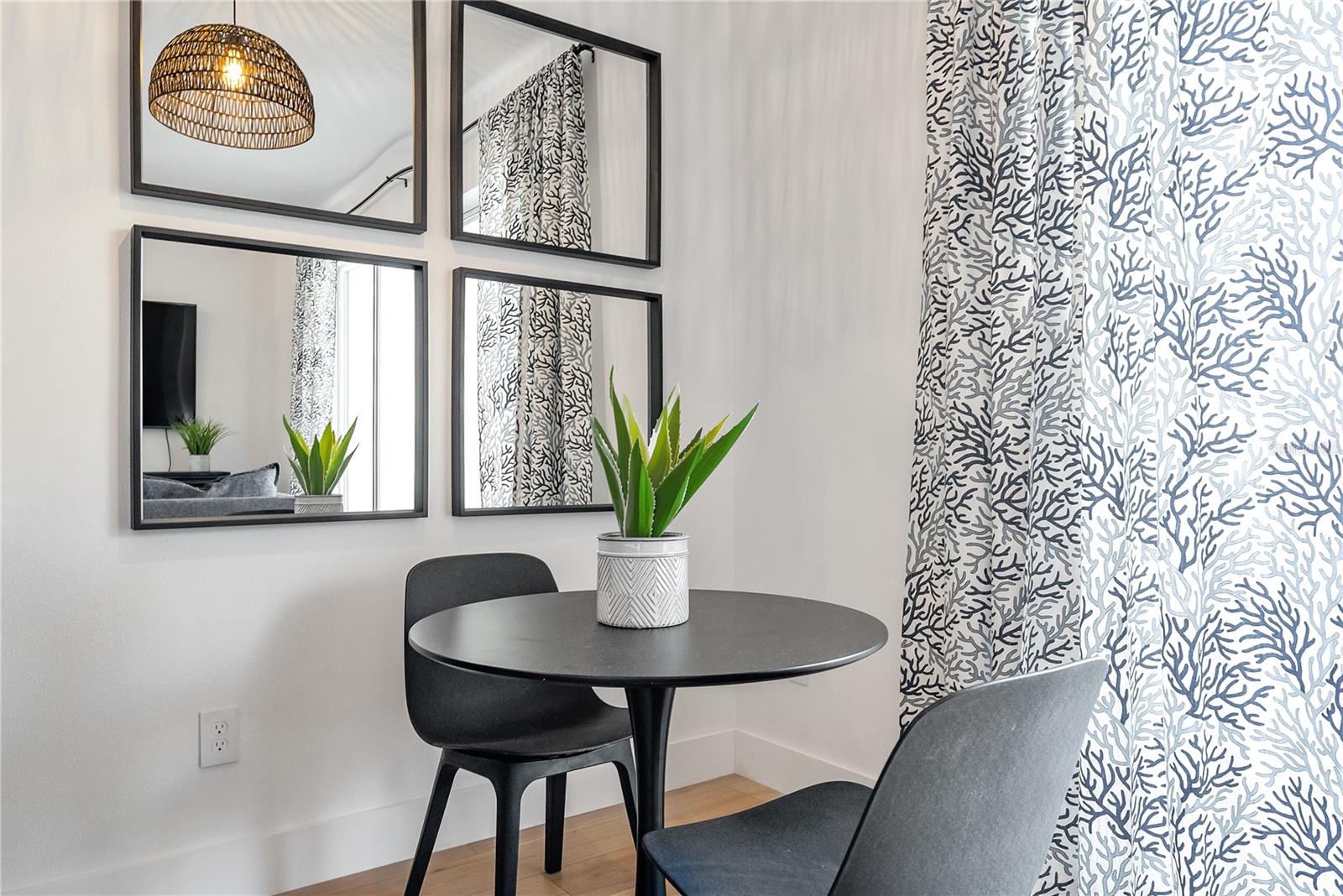 dining area and custom blackout temperature reducing drapes