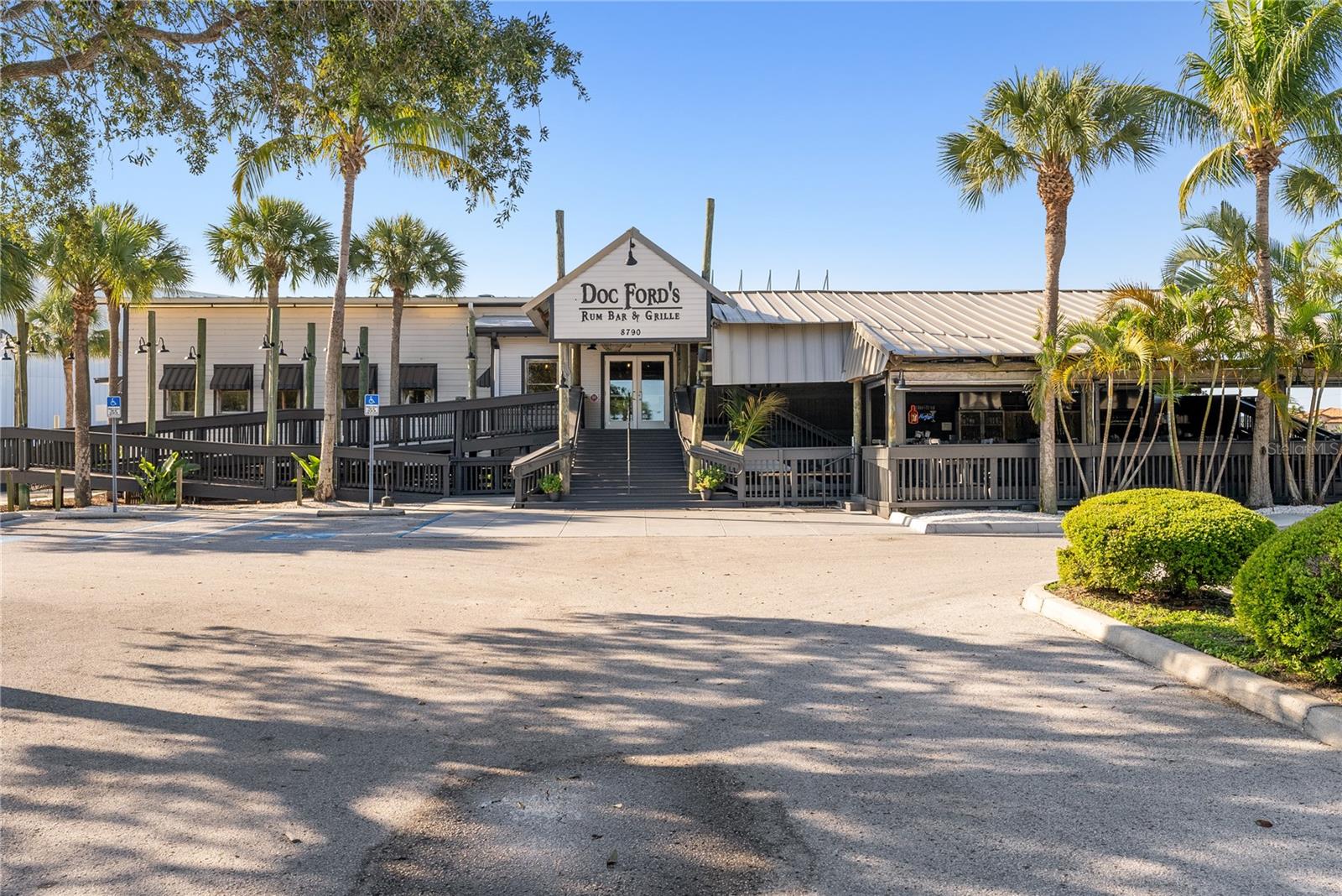 View of Doc Ford's Rum Bar & Grille restaurant in shared parking lot