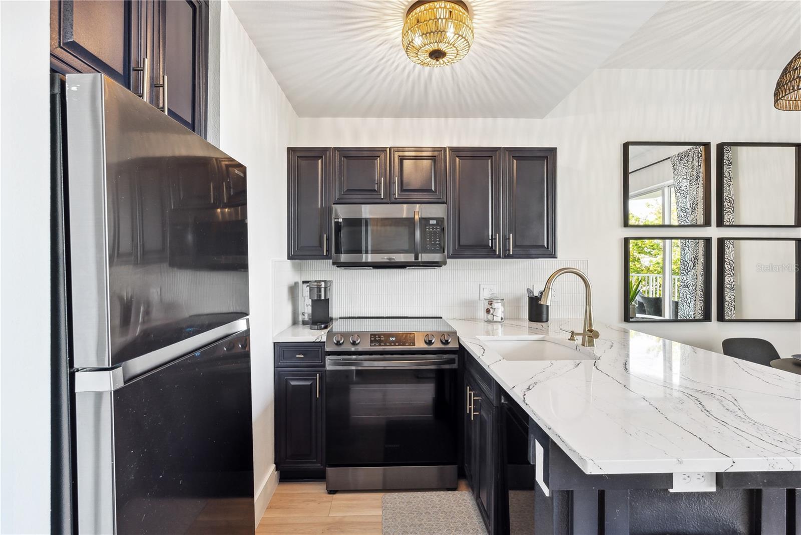 Spacious kitchen with Cambria Quartz "Portrush" series luxury countertops and 2023 new appliances
