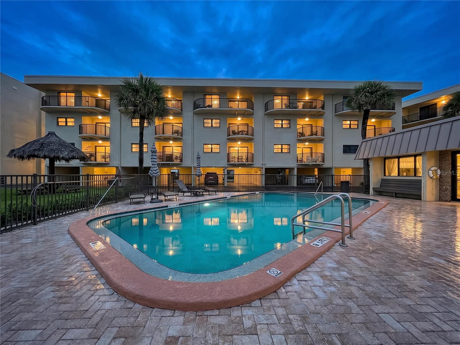 Pool with tiki hut and Clubhouse.