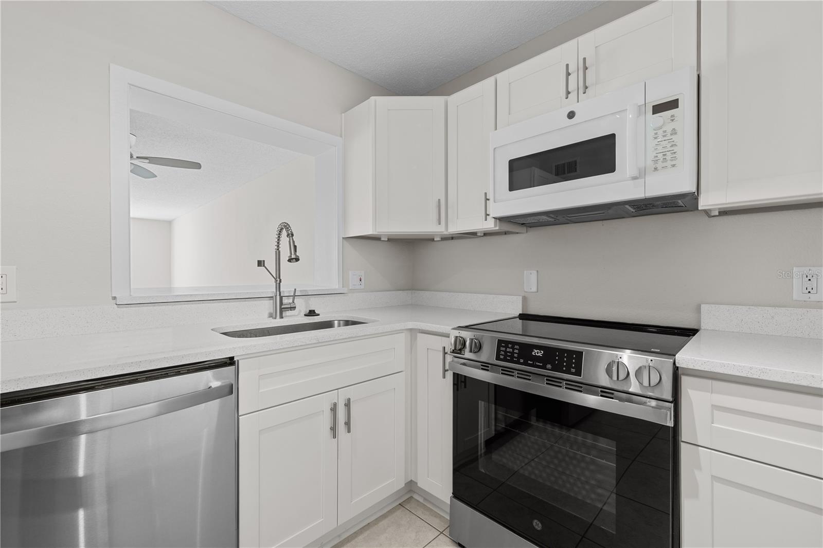 Newly renovated kitchen with white shaker cabinetry and Stainless Steel Appliances