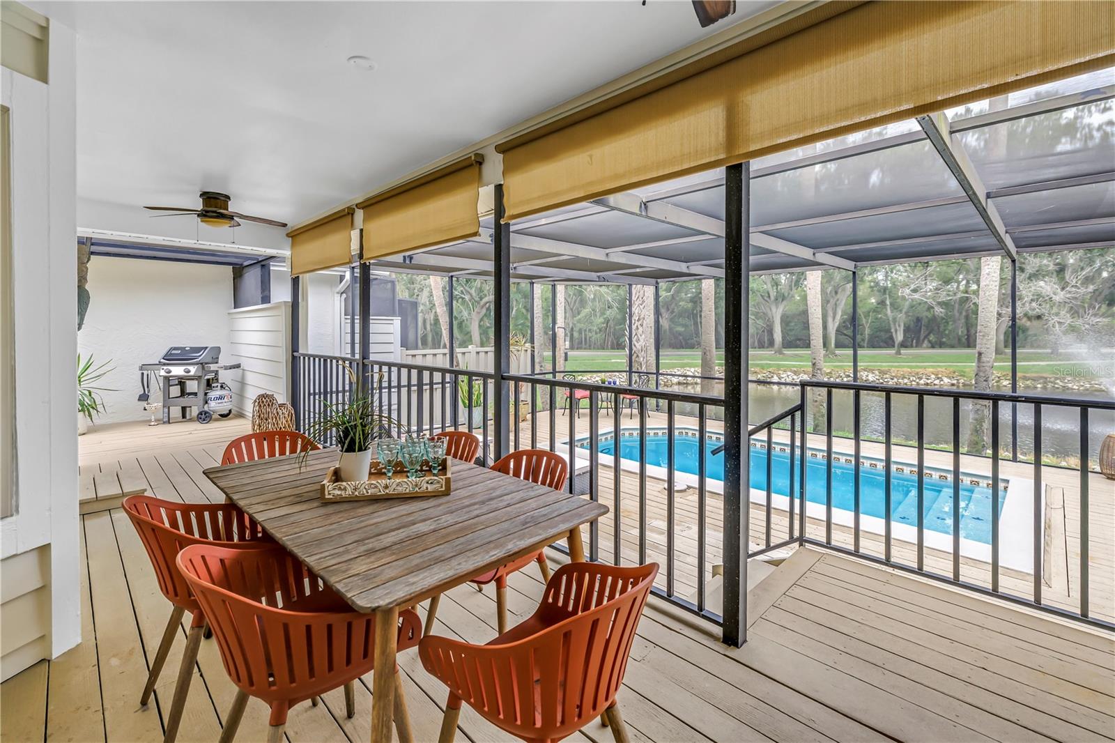 Dining al fresco under the shady roof and view of the lake and pool is Vacation!!!  everyday