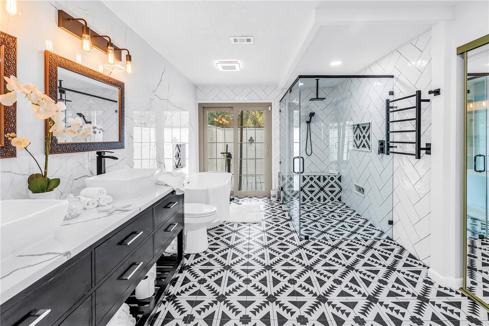 Defining Luxury Primary with Geometric Porcelain Floors, Seamless Glass and Private Outdoor Patio