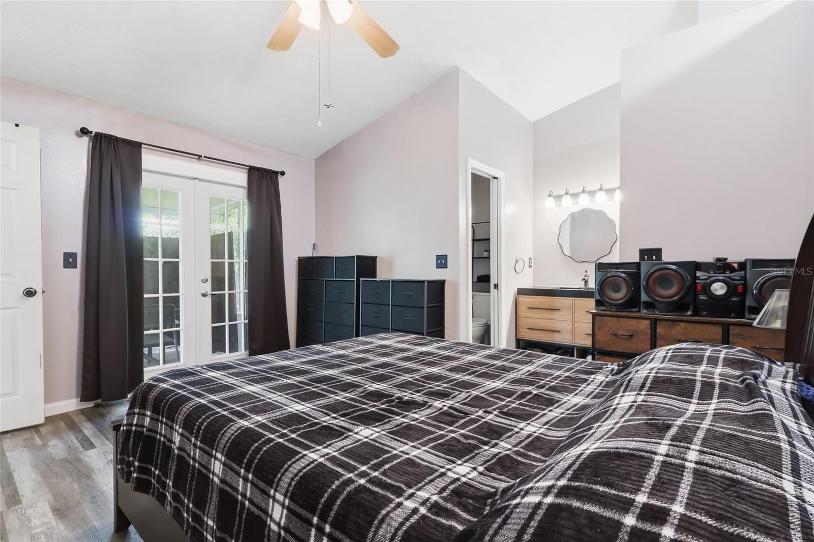Primary bedroom with French doors to lanai