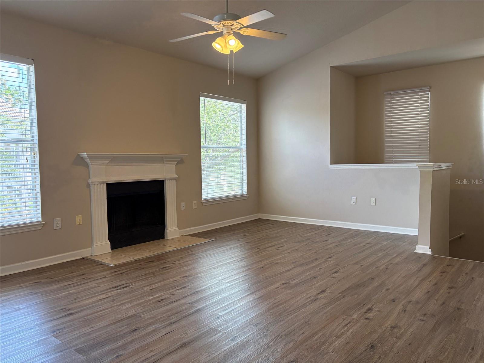 Main living area, stairs to garage at right.