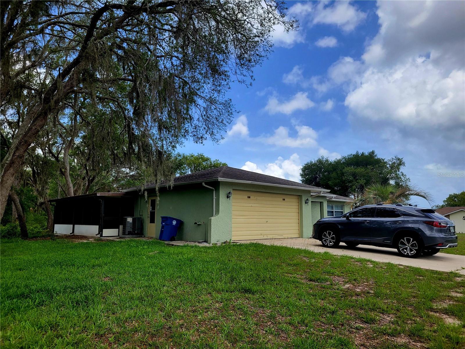 Opposite side yard with enclosed spacious Lanai