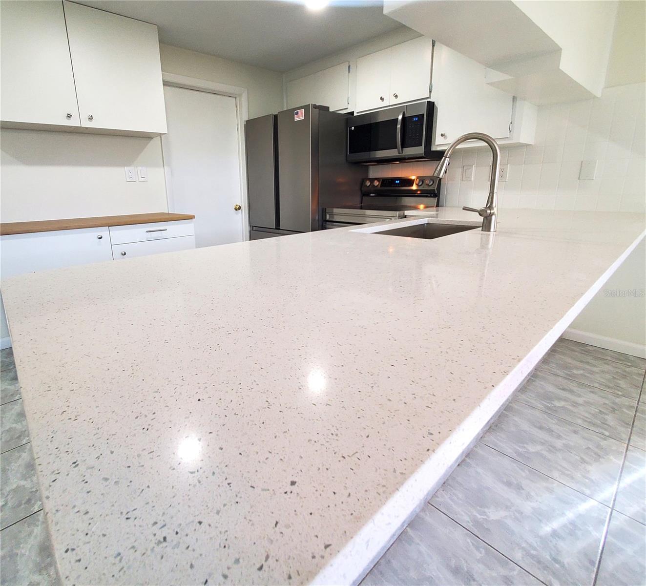 large counter with new stainless steel sink