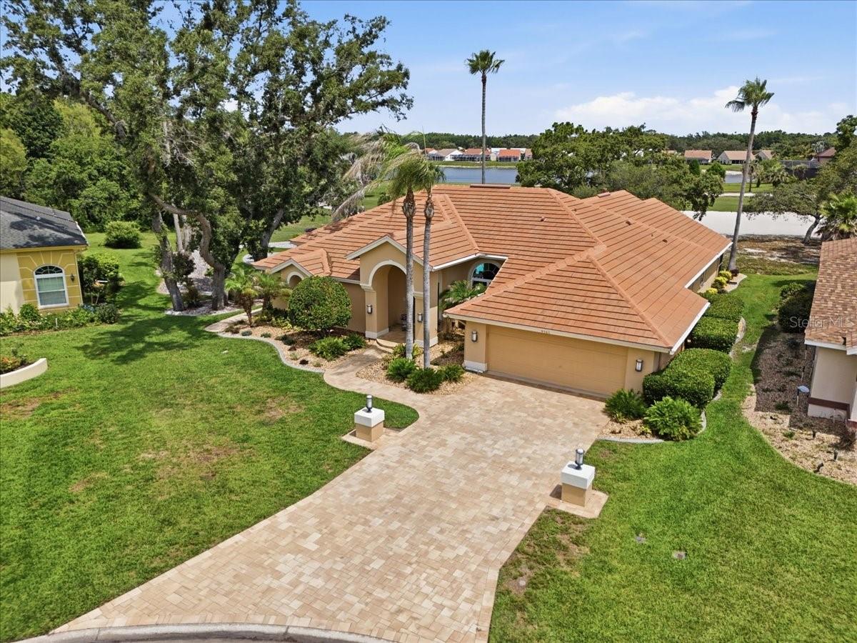 Long paver driveway and tile roof