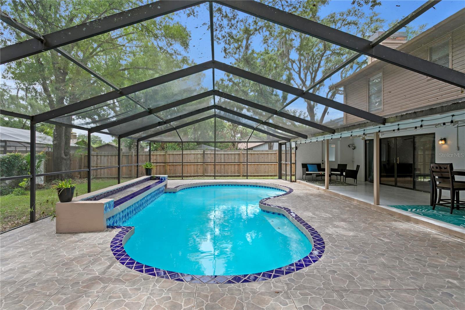 This home features a pool and covered lanai