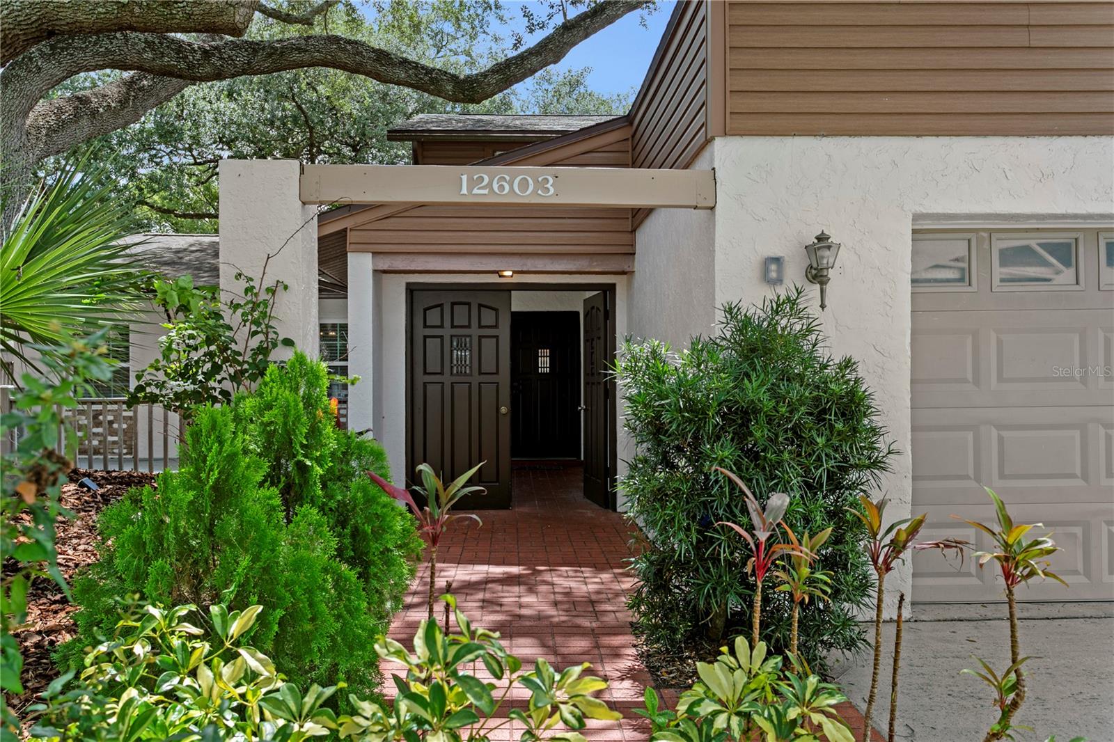 Enter through the beautifully landscaped courtyard