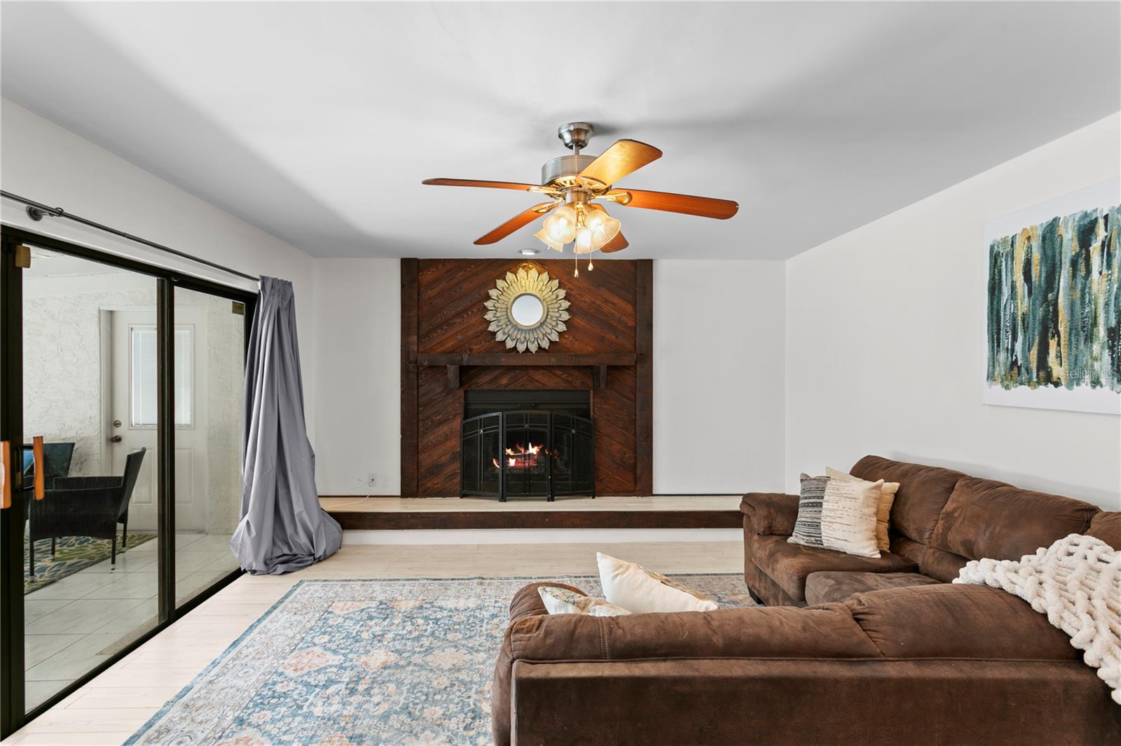 Family room features wood-burning fireplace