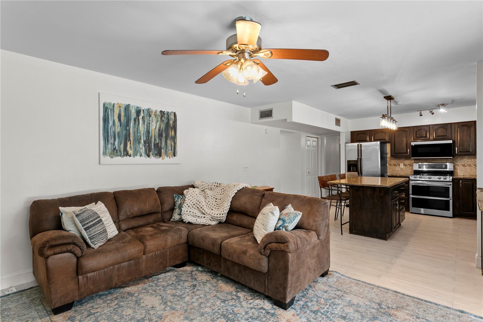 Large gathering space with kitchen flowing into family room