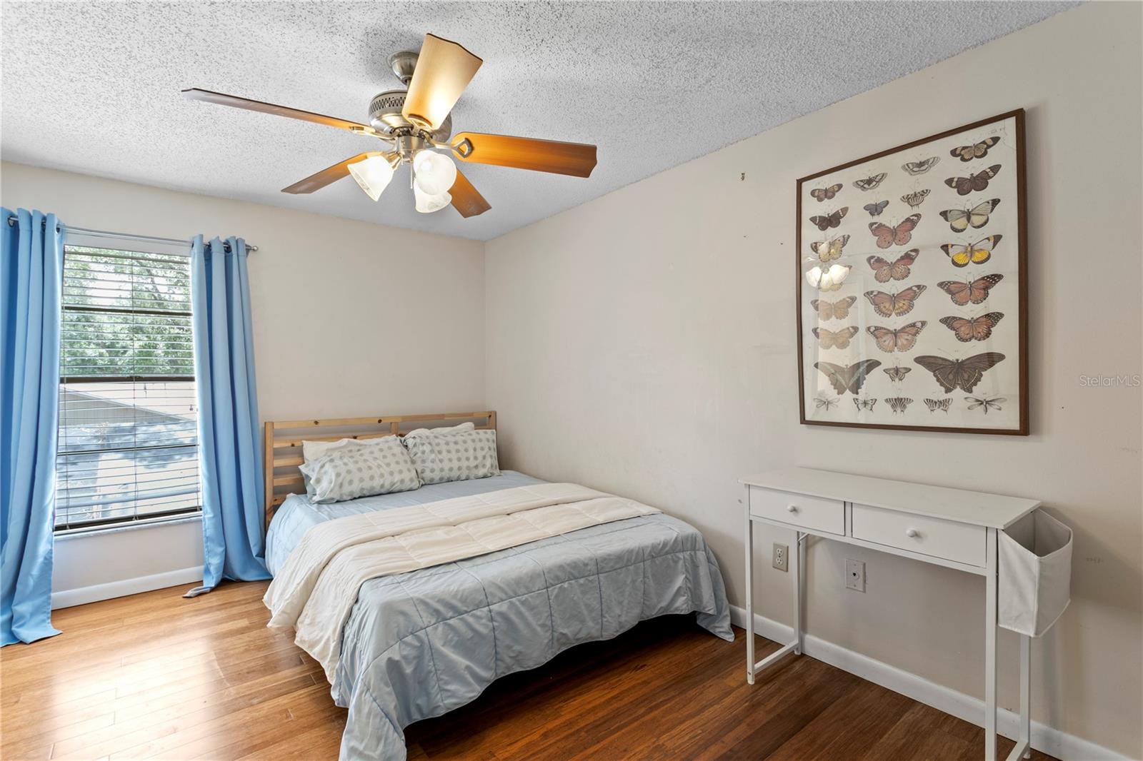 Bedroom 3 with hard wood floors and ceiling fan