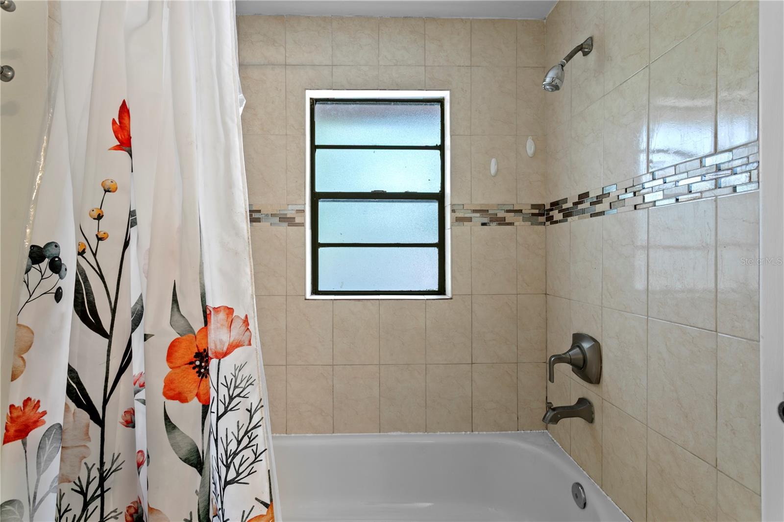 Bathroom 2 with tiled shower and tub