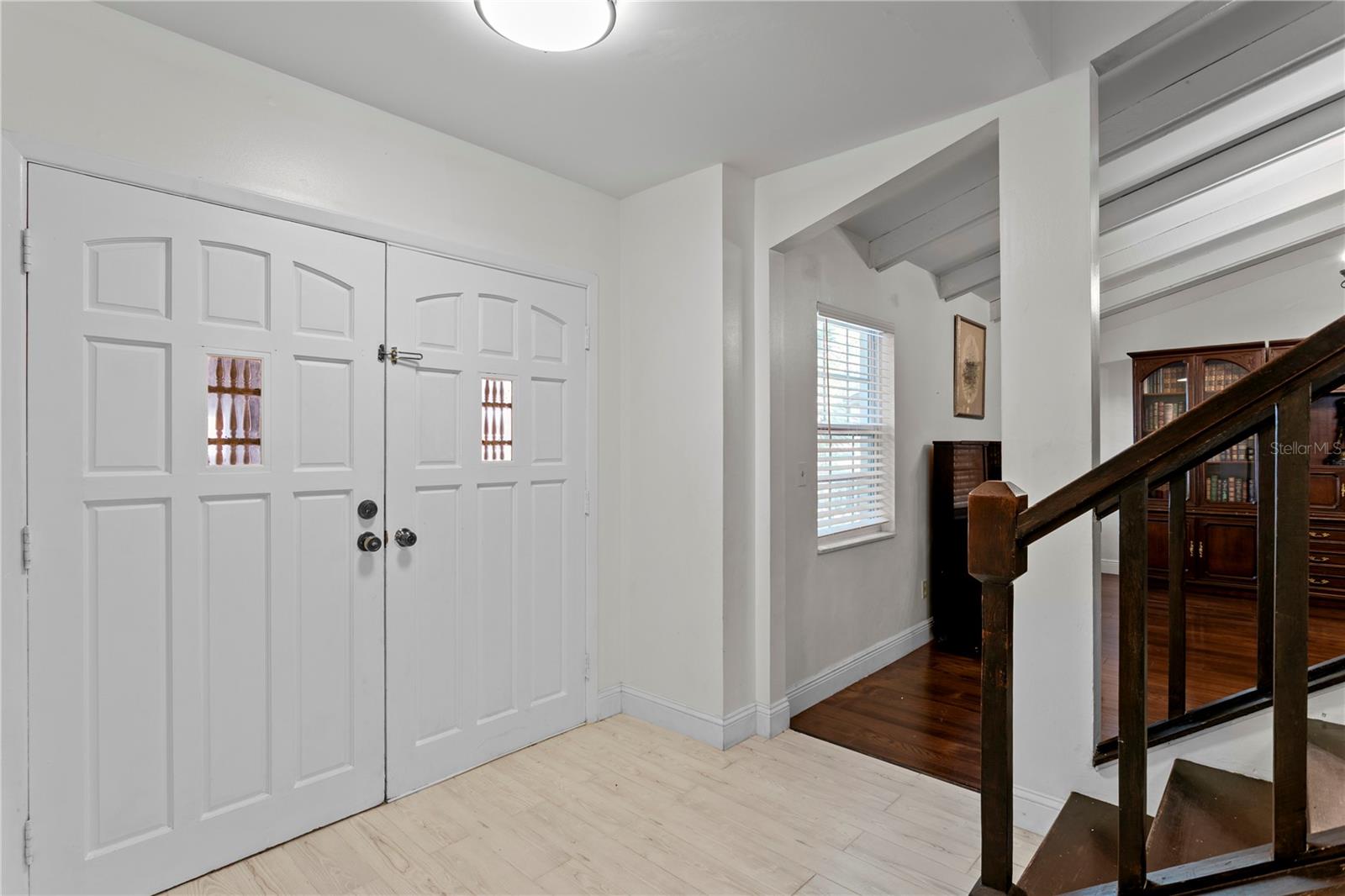 Welcoming foyer with ceramit tile flooring