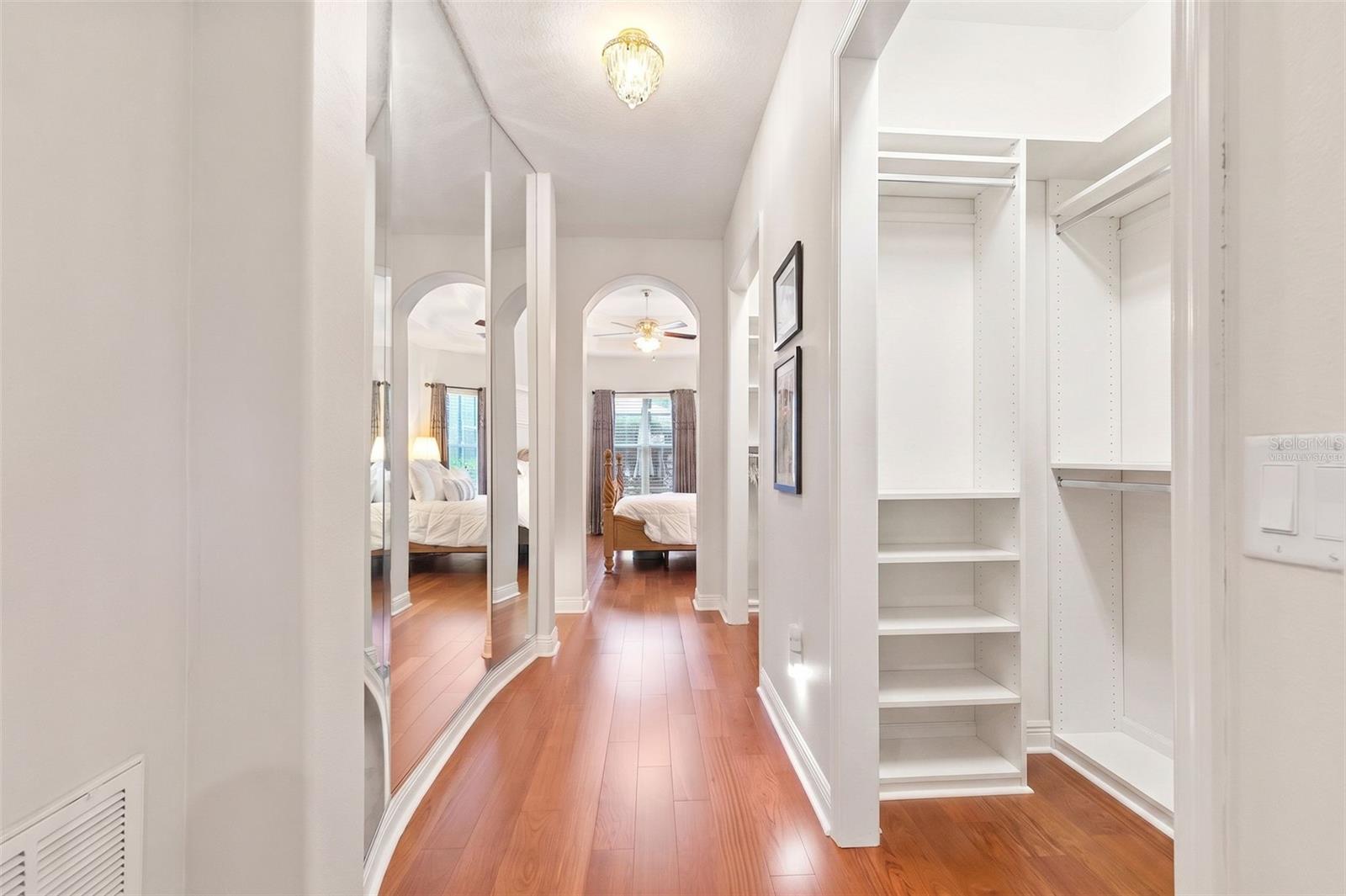 Virtually staged- Primary Walk-In Custom Closet Two