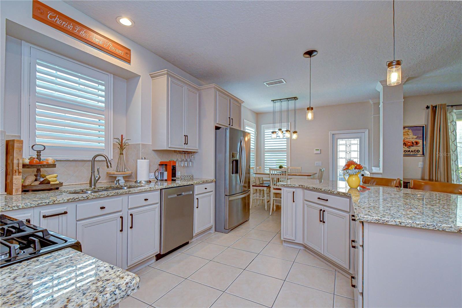 Beautifully updated kitchen with granite countertops and custom cabinetry.