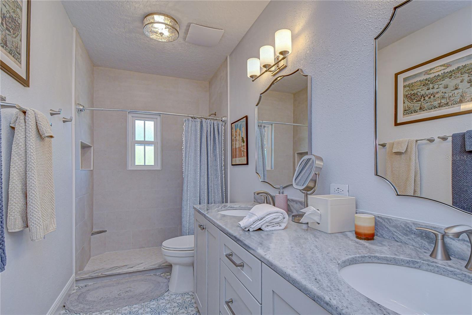 Well-appointed bathroom serving secondary bedrooms.