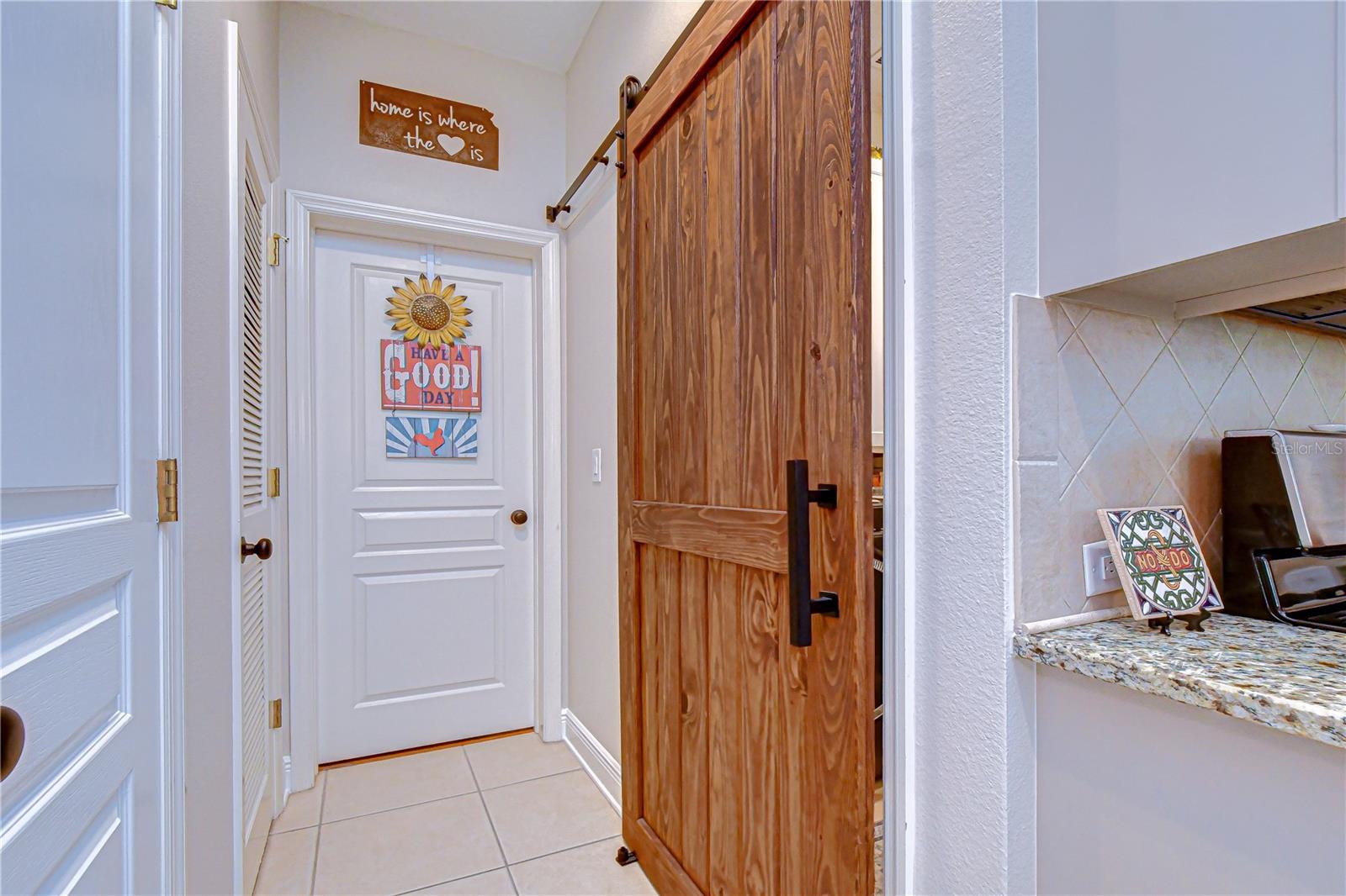 Hallway to bathroom and laundry room