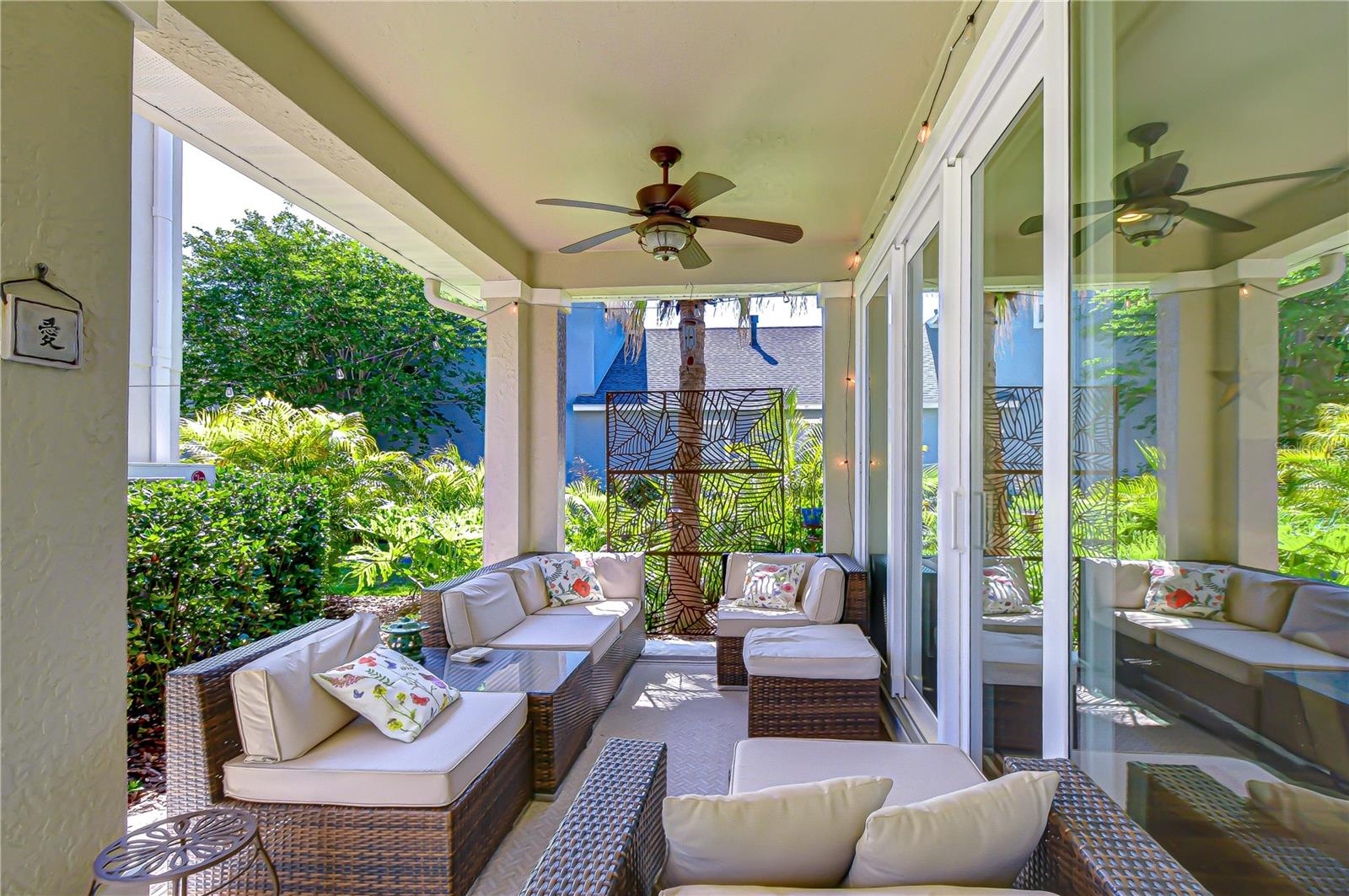 Relaxing back porch ideal for enjoying Florida's year-round sunshine in comfort.