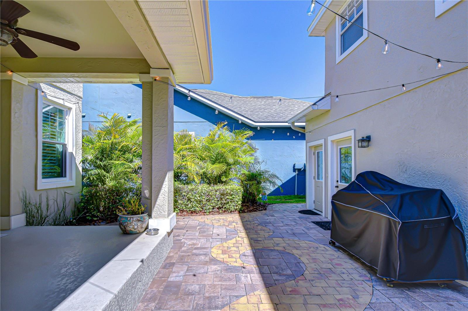 Relaxing outdoor living space overlooking the backyard.