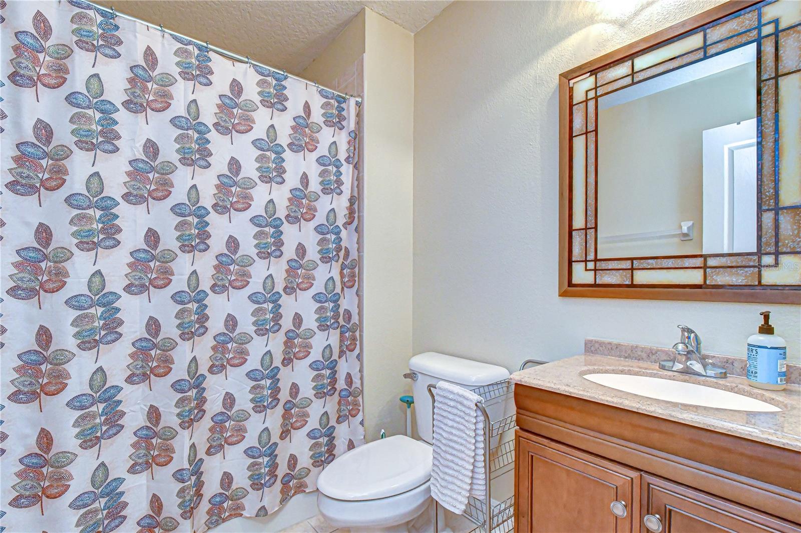 Full bath within the detached apartment space.