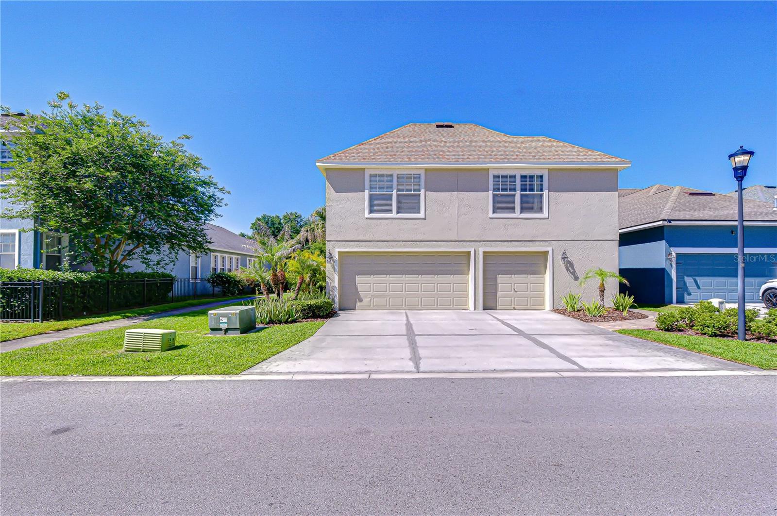 Detached three-car garage with additional apartment above.