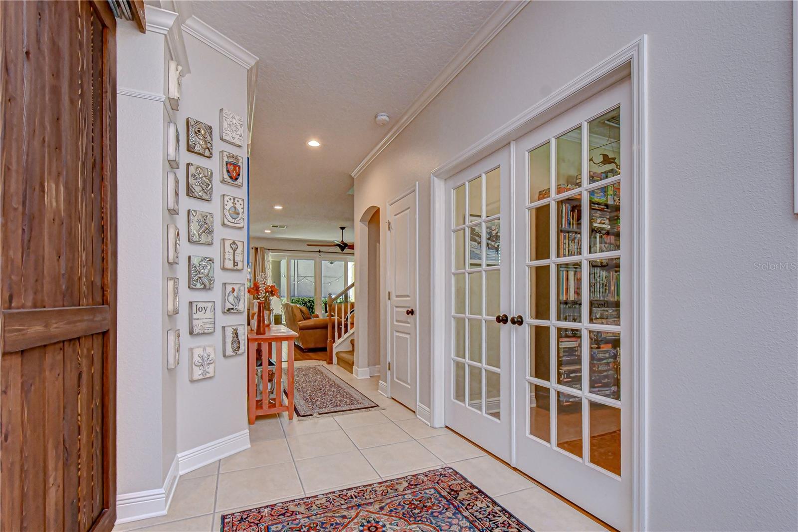 Private home office behind elegant French doors, offering the perfect work-from-home setup.
