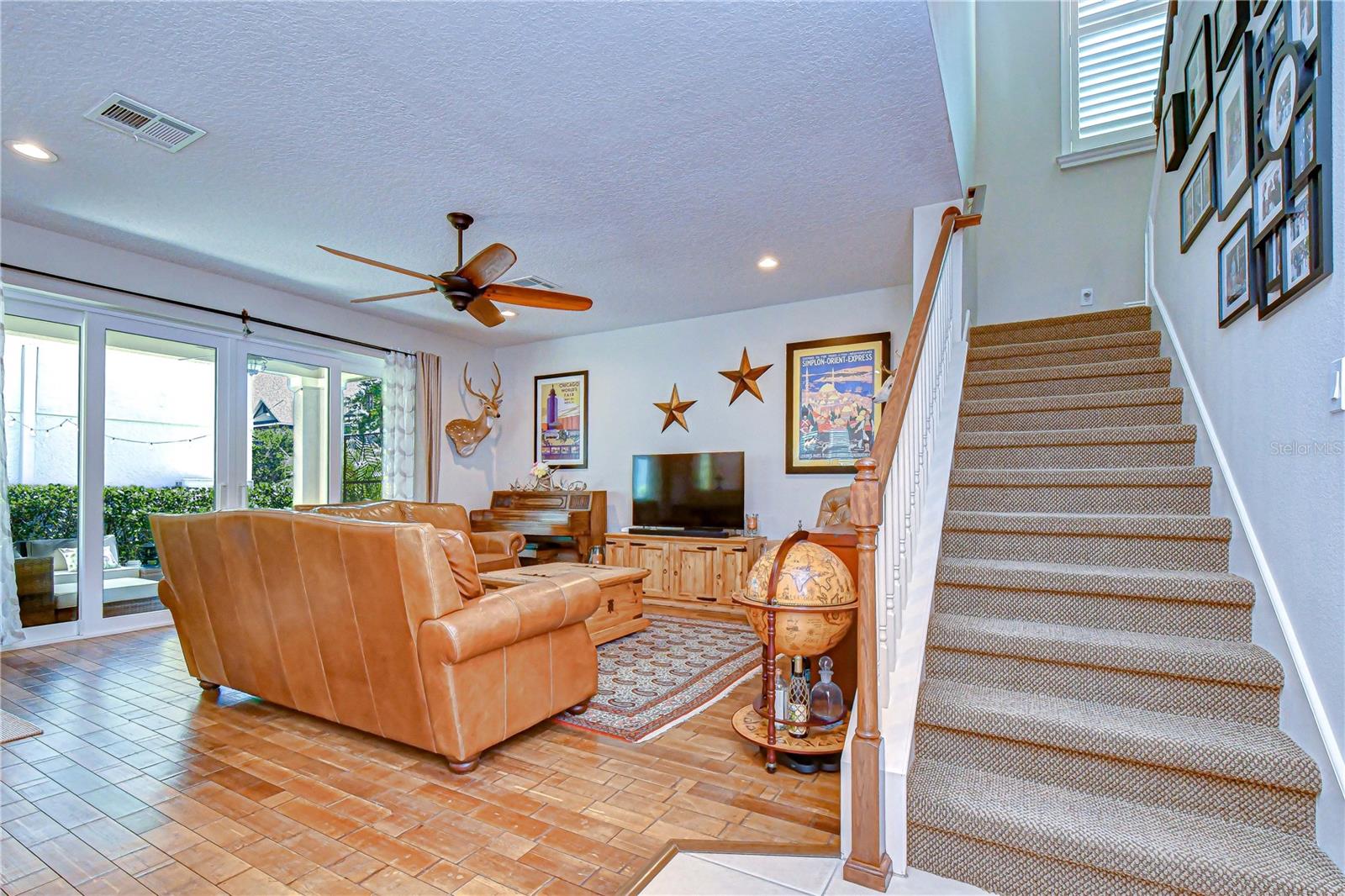 Spacious gathering area showcasing the open staircase and excellent natural airflow design.