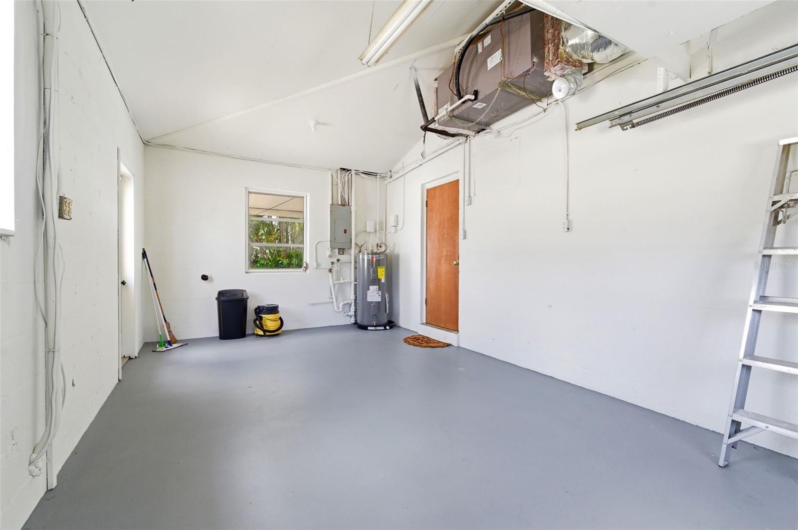 Garage New Painted Floor Washer/Dryer Hook up