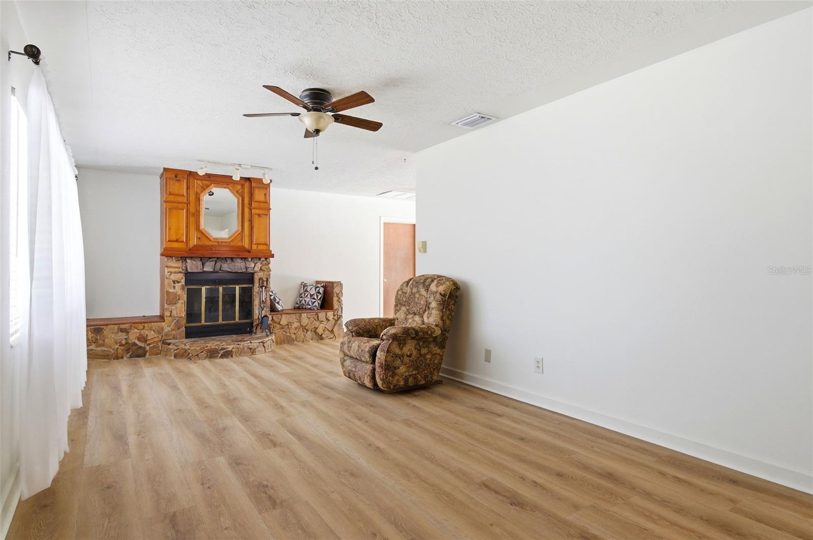 Living Room w wood burning fireplace