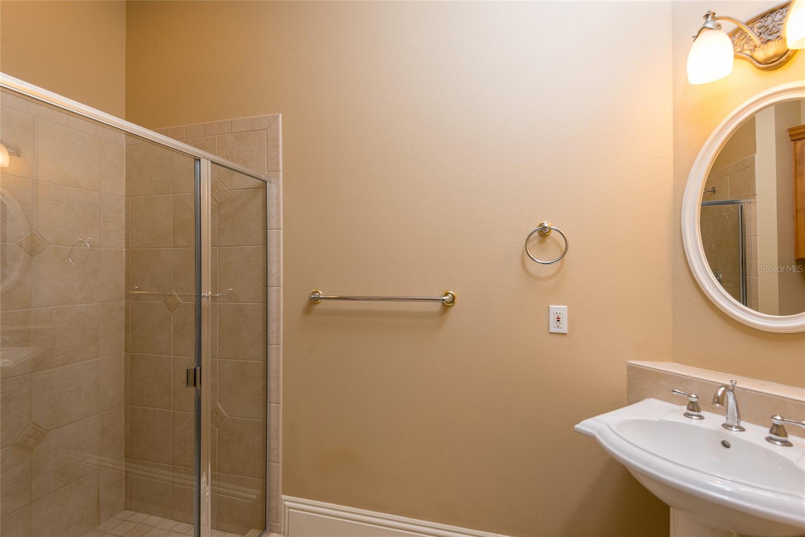 Full bath attached to first floor bedroom with walk-in shower