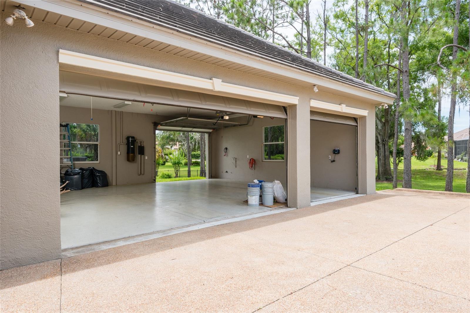 3 car attached garage with dpassthrough to launch your boat at the private boat launch