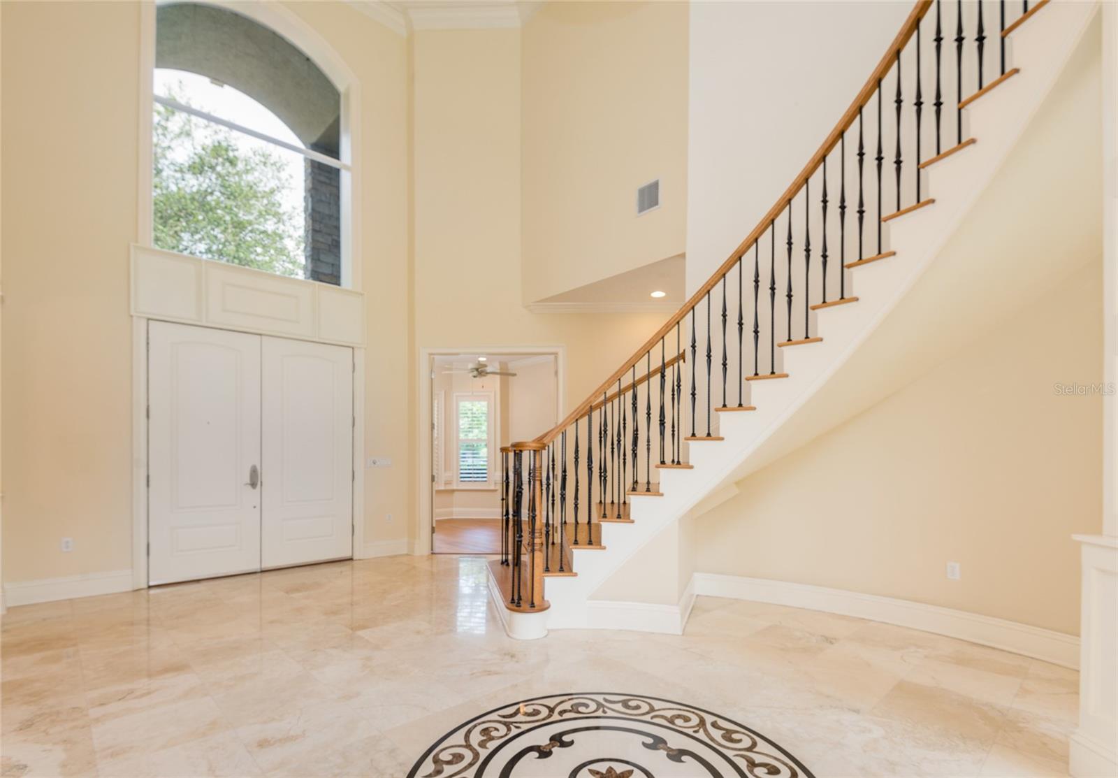 custom travertine inlay in the foyer