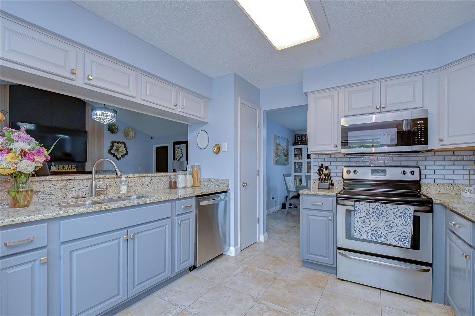 View of stove and microwave.