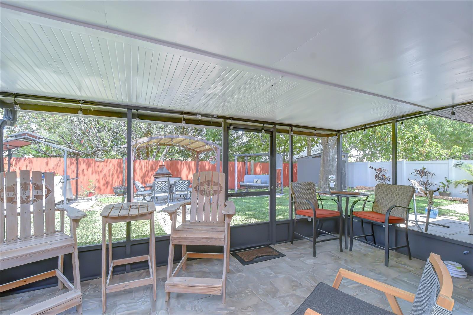 Screened in porch overlooks your magazine ready backyard with new grass.  I think this is my award for this years outstanding backyard!  Come see what you think.