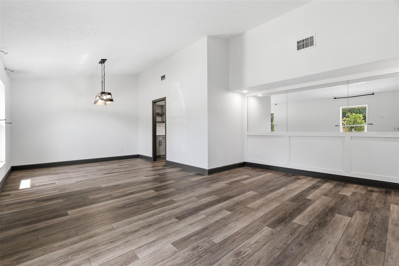 Mirror accent, recessed lights, accent wall